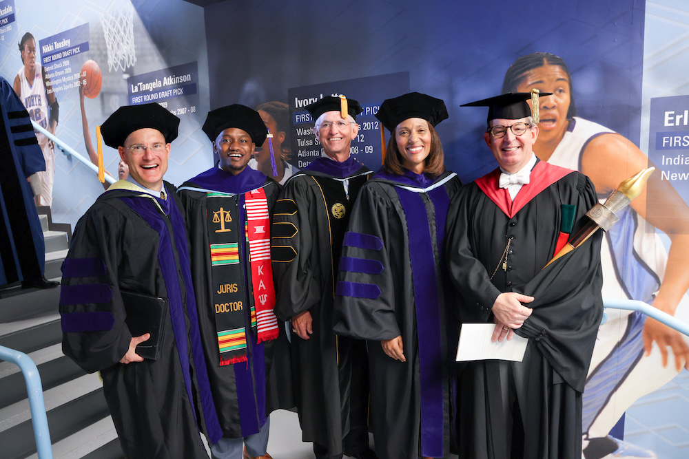 Dean Craig Smith, SBA President Trey Ellis, Jim Deal, Sydney Batch and Dean Martin Brinkley pose together before processing in to commencement.