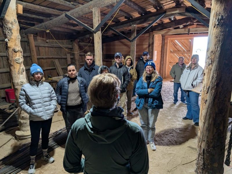 The student group listening to a presentation by a Heart Mountain staff member in the historic root cellar that the prisoners built in order to store vegetables grown in the camp’s farming operations