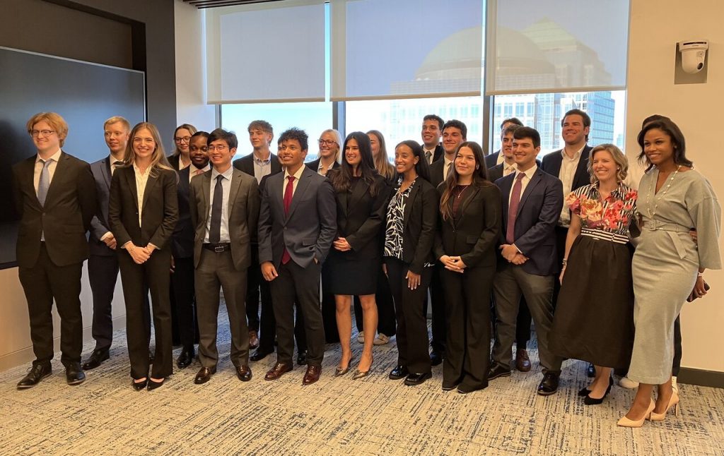 a group of students standing and smiling