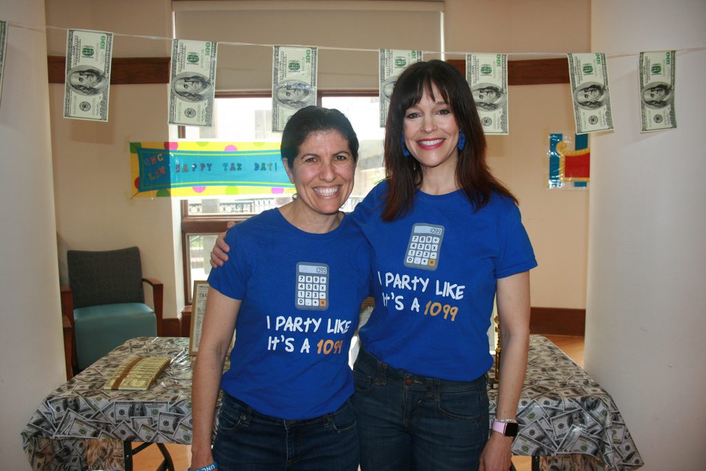 two women with tax decorations