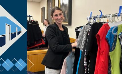 student with clothes rack